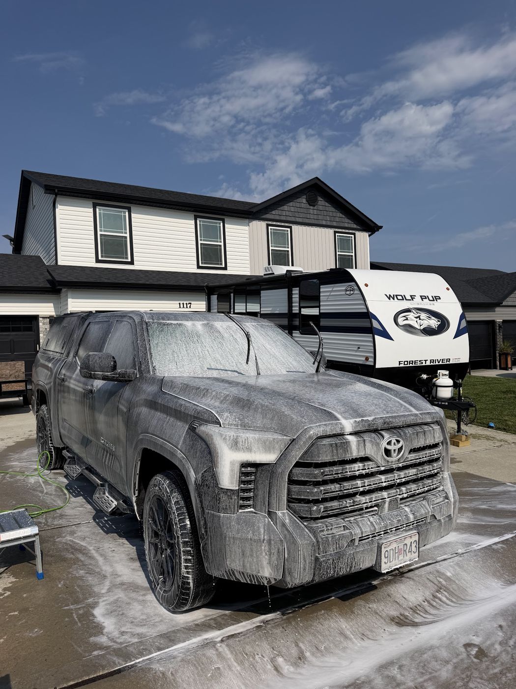 Foam bath lifting grit before contact washing